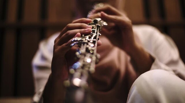 Close-Up of Musician Playing Flute in Studio