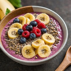 Colorful smoothie topped with chia seeds, banana slices, berries, bright clean background