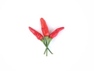 Fototapeta premium Three fresh red bird's eye chilies isolated on white background. Perfect for culinary, spicy food, and healthy ingredient themes