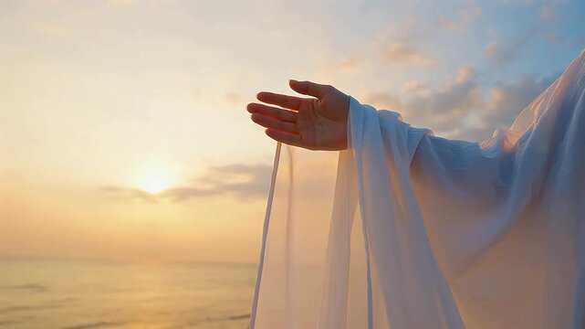 Person extending hand at sunset by sea