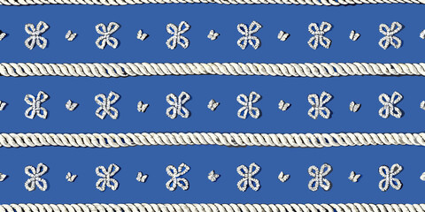 Nautical rope and decorative knot pattern on a blue background © Shuvra Majumder