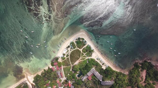 Stunning tropical shoreline with coral reef and clear turquoise water at sunrise in Sri Lanka. Low tide exposes reef patterns beneath calm ocean surface, creating peaceful and scenic marine landscape.