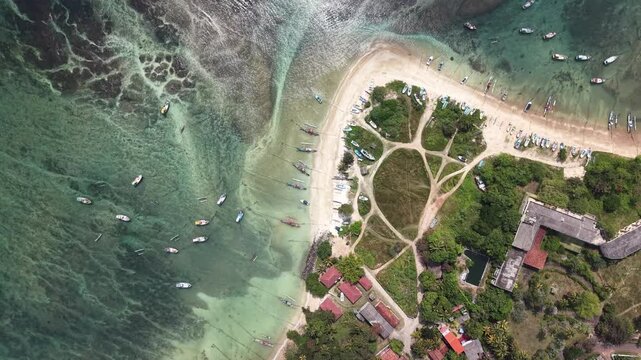 Beautiful coral reef revealed by low tide in the early morning light in Weligama. Calm azure ocean, natural reef textures visible through transparent water, and serene tropical atmosphere