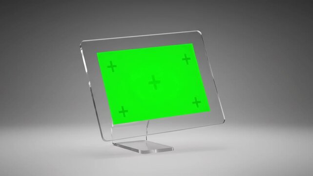 A sleek, transparent computer monitor with a green screen setup, ideal for digital art and advanced presentations.