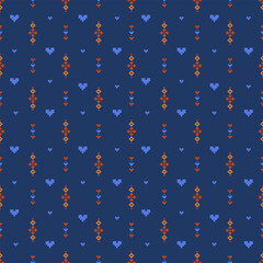 Seamless pixel folk pattern with vertical geometric motifs and small heart shapes on a deep blue background. Repeating grid layout in orange and light blue tones, ideal for fabric and surface design.