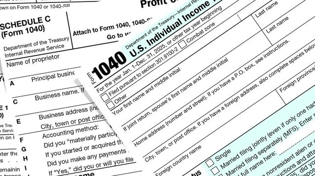 Filled out  IRS form 1040 U.S. individual income tax return with attached Schedule C for profit or loss.