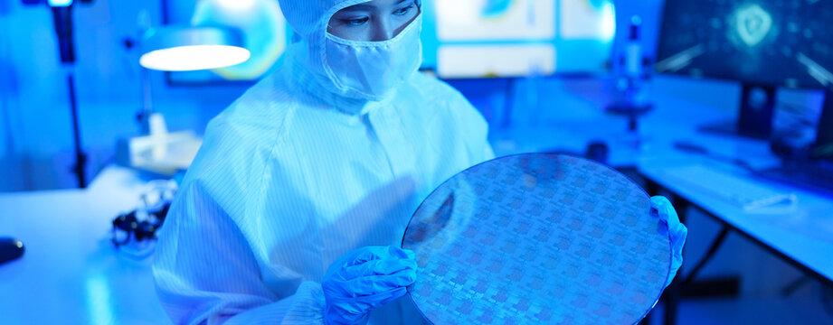 Technician working on analyzing semiconductor or microchip boards, electronics industry, electronic engineer, computer technology, CPU maintenance, hardware, motherboard component upgrades.