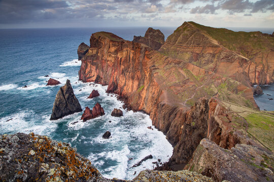 Dramatic coastline and rock formations along the ocean in Madeira, Portugal, near Canial during daytime viewing
