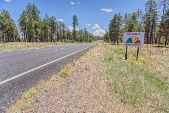 A warning sign of high wildfire danger along Highway 67 near Jacob Lake on the way to Grand Canyon North Rim, Arizona