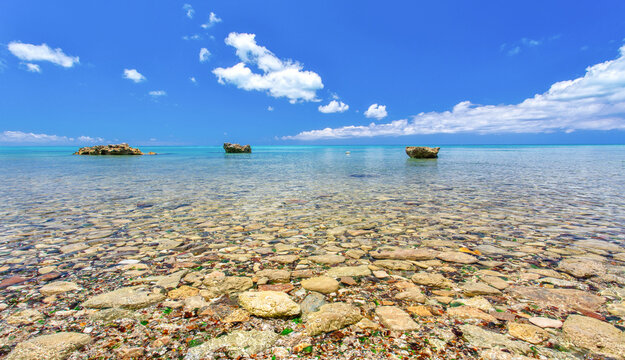 The blue Sargasso Sea (with pieces of sea glass glinting beneath) at Glass Beach, Ireland Island South, Somerset, Bermuda