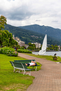 Tourists on the lakeside in Stresa. Stresa, Lake Maggiore, Verbano Cusio Ossola discrict, Piedmont, Italy, Europe