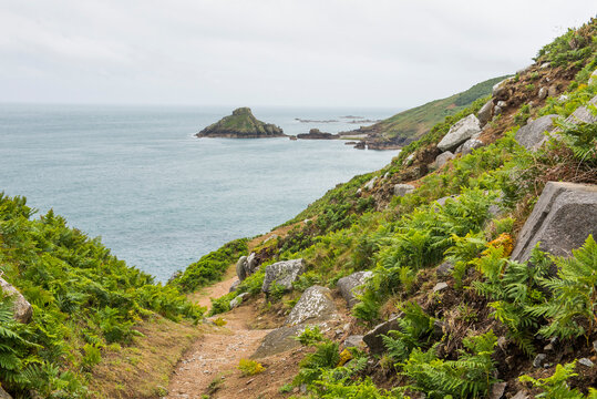 Trail on the west coast with Jethou Island in the distance, Herm Island, Bailiwick of Guernsey, United Kingdom