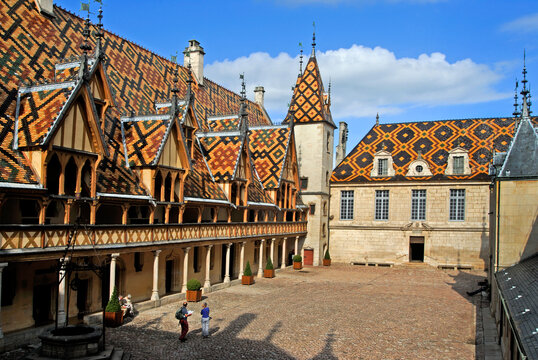 Inner courtyard surrounded by polychrome tiles of the roof at Hotel-Dieu of Beaune, Cote-d Or department, Burgundy region, France, Europe