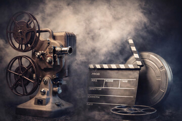 Vintage Film Projector and Clapperboard in Cinematic Smoke