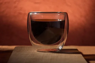 Fototapete Rund Cafe Close-up of a glass cup with black coffee.  © arieldufey