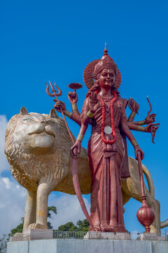 The 33 meter high statue of the Hindu goddess Maa Durga with a golden lion, at the entrance to the Grand Bassin Temple, Mauritius