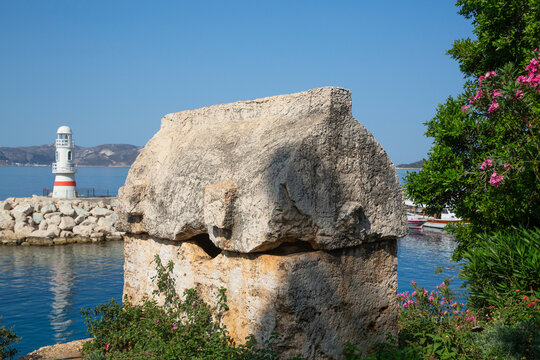 Lycian Sarcophogus (foreground), Kas Marina Lighthouse, Kas, Antalya, Turkey