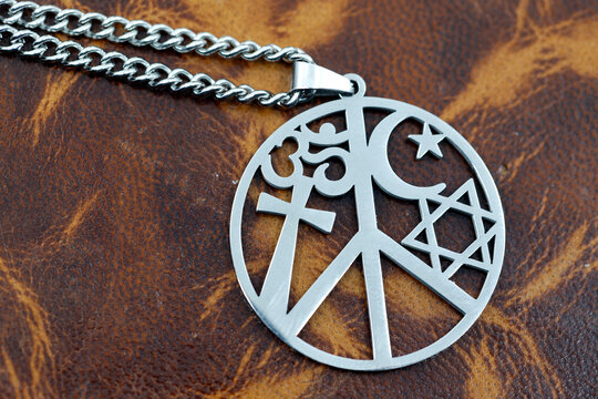 Pendant with symbols of major religions. Christianity, Judaism, Hinduism. Cross, Star of David, crescent and Om