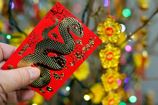 Red envelopes ( hongbao ) for Chinese and Vietnamese New Year celebration. Red color is a symbol of good luck.