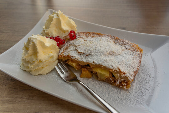 View of traditional apple strudel and cream, Bruckberg, Salzburg, Austria, Europe