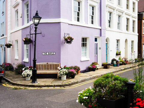 Colorful corner of the Bayle with flower pots and a bench in Folkestone Kent