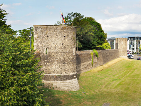 Exploring Canterbury City Wall in Kent with historical architecture and green surroundings
