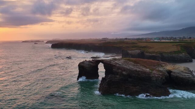 Sunrise at Cathedrals beach in Cantabria, Spain, aerial view of playa de las Catedrales on Spanish Atlantic coast, tourist destination in northern Spain