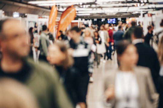 Abstract blurred people at exhibition hall of expo event trade show. Business convention show or job fair. Business concept background