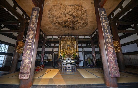 Interior view, golden Buddha figure and ceiling painting with dragon figure, Amidado, Buddhist temple, Konkai-Komyoji temple, Kyoto, Japan