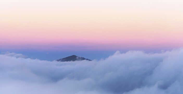 Jura foothills strehen over the sea of fog in the light of dawn, Talheim, Canton of Aargau, Switzerland