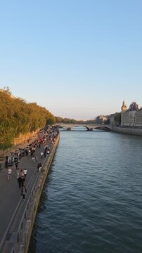 Paris, France - 12 October 2025 - Seine River View from Riverside Promenade in Paris at Golden Hour &ndash; Vertical Video