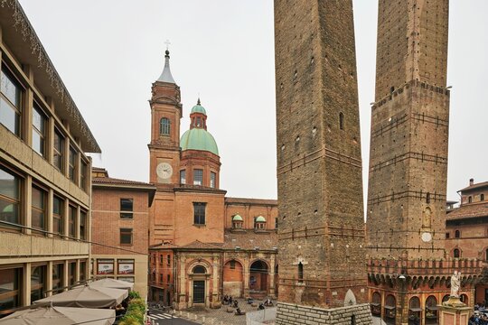 Garisenda and Asinelli towers, Santi Bartolomeo and Gaetano churches in the back, Bologna, Emilia-Romagna, Italy