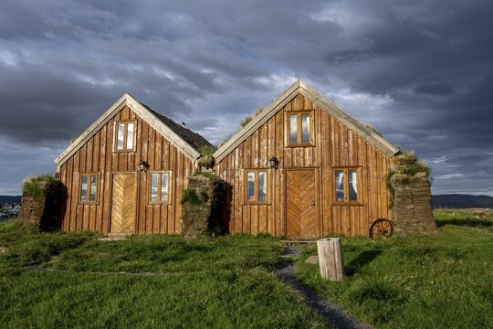 Traditional wooden peat houses with grass on the roof, in the evening light, M&ouml;&eth;rudalur, Icelandic highlands, Iceland