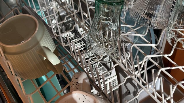 Dishwasher finished cycle clean glasses mugs cups real UGC top view  kitchen appliance laundry home photography sparkling ready unload shot cutlery plates steel