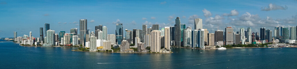 Obraz premium Panorama of Miami Brickell skyline. Panorama cityscape of Brickell Miami. Scenic drone view of Florida coastline. Miami skyline with skyscrapers.