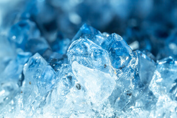 Obraz premium Blue Crystal Mineral Stone. Gems. Mineral crystals in the natural environment. Texture of precious and semiprecious stones. Seamless background with copy space colored shiny surface of precious stones