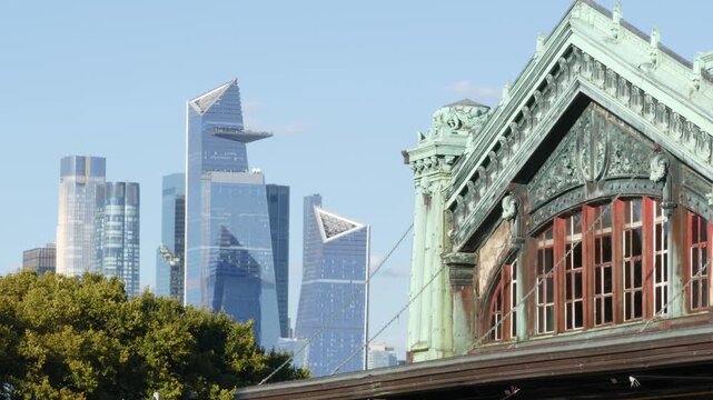 New York City Manhattan Midtown Hudson Yards towers from New Jersey, old historic ferry boat terminal 1907, Hoboken, United States. American highrise skyscraper building and green cooper architecture.