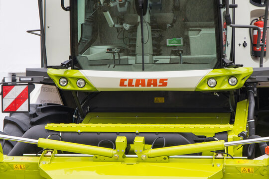 Bednary, Poland - September 25, 2021: Agroshow. Front of combine harvester with Claas logo. Manufacturer of agricultural equipment