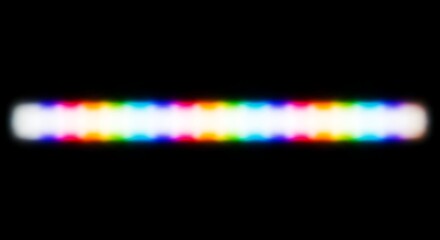 Rainbow light streak on black background
