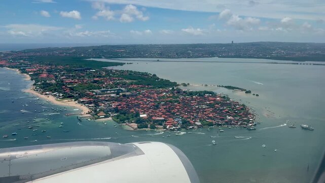 Plane landing in Bali Indonesia view from the window during landing