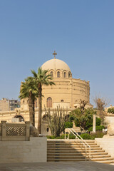 Historic church St. George in Coptic Cairo with domed sanctuary and urban surrounding buildings. View from Coptic museum
