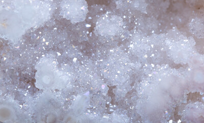 Fototapeta premium Brilliant Precious stones. Mineral crystals in the natural environment. Texture of precious and semiprecious stones. Seamless background of colored shiny surface of precious stones. Argonium white.