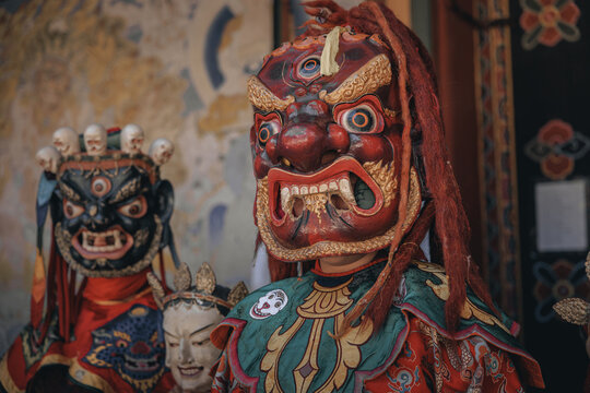 Jakar Dzong, Bhutan - 24 September 2025: View of fierce, vibrant masks adorned with intricate details, standing out against the backdrop of the painted walls.