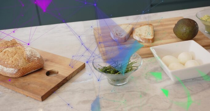 Displaying crusty loaf resting on wood board on marble counter with eggs avocado rosemary overlay