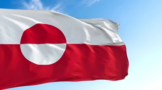 Greenland flag waving against bright blue sky