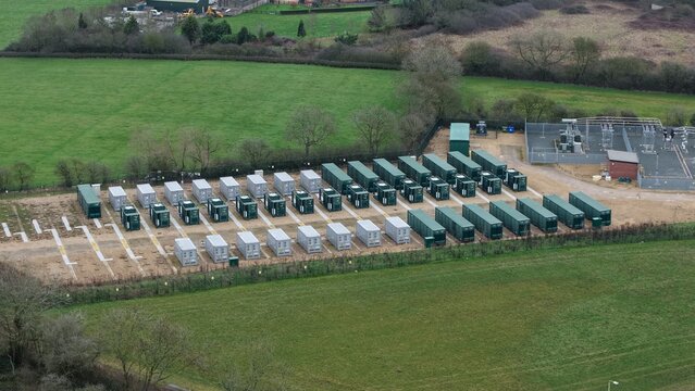 Close up aerial view of the Enderby BESS battery energy storage facility in the UK showing CATL units for national grid power supply support.