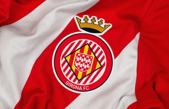Kyiv, Ukraine. February 16, 2026. Girona FC crest on red and white striped jersey fabric close up