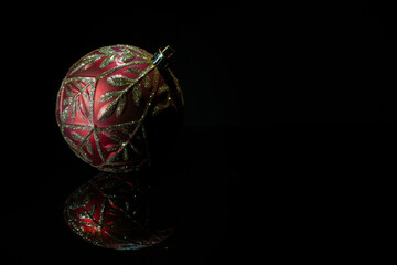 Red and gold ornament for celebrations with copy space in the black