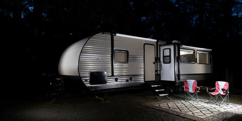 Nightfall in a forested RV campsite