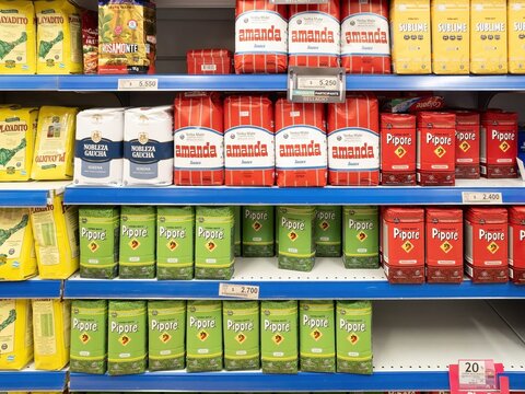 Puerto Natales, Chile - July 10th 2025: Yerba mate products filling grocery store shelves, offering diverse brands and packaging in a retail environment